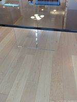 Full view of smoked glass top and acrylic leg