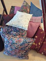 Stack of assorted cushions showing patterns and colours