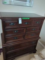 Front view showing all seven drawers and hardware