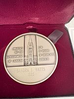 Sterling silver medallion showing inscription and design