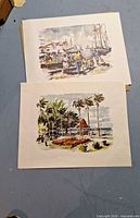 Both prints laid out showing full images and paper texture