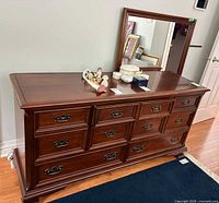 Front view of dresser with mirror, shows drawers, hardware and finish