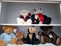 Overview of all plush toys on two shelves