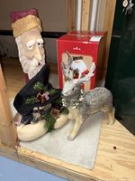 Front view of all four figurines grouped together