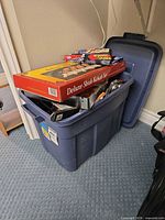 Tote containing boxed deluxe shish kebab set and assorted grill items