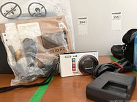 Camera with charger, cables, manual and box
