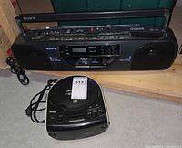 Sony CFS-W505 boombox and Sony ICF-CD814 clock radio CD player with cords