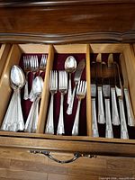 Drawer view showing entire flatware set arranged by utensil type