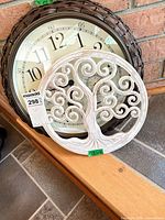 Clock and tree plaque together showing sizes and designs