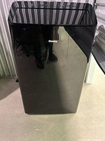 Front view of black Danby portable air conditioner