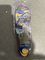 Front view of sealed Dr. Scholl's Back Pain Relief Orthotics blister pack