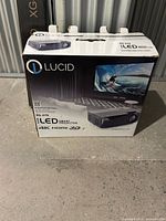 Front view of Lucid XG-270 projector retail box showing model and features