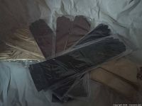 Fan arrangement of six glove pairs showing colours and packaging