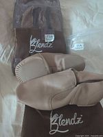 Both pairs of Blendz dance shoes with mesh bags labeled 11A and 12A