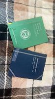 Blue Lincoln cent folder and green nickel folder closed
