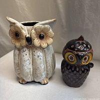 Both ceramic owl containers side by side showing relative sizes and overall form