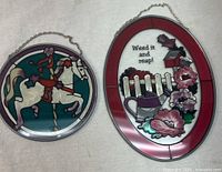 Both stained glass panels side by side showing designs and chains