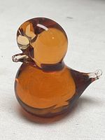 Full view of amber glass bird figurine