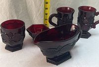 All five ruby red glass pieces grouped together