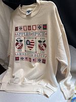 Full view of cream Apple Spice graphic sweatshirt