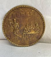 Front view of brass plaque showing full colonial tavern scene relief and rope edge