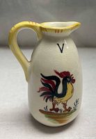 Full view of ceramic vinegar cruet showing rooster design and V mark