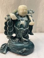 Front view of two-tone resin Laughing Buddha on base