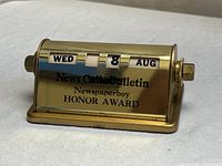 Front view showing date wheels and award inscription