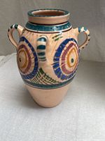 front view of amphora vase showing painted design