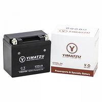 Front view of battery beside retail box showing branding and model