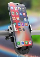 Phone mount attached to handlebar holding smartphone