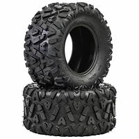 Pair of new Yimatzu IronHorn ATV tires, one upright, one flat