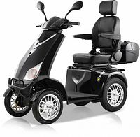 Front-side view of black Shock Mobility Navigator scooter showing four wheels, seat, and body