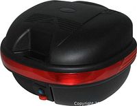 Top view of black PHX scooter trunk showing lid design and red reflector