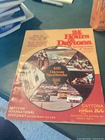 Front cover showing 24 Hours of Daytona / 1976 Daytona Speedweeks montage
