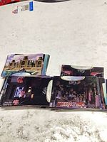 Stacks of Babylon 5 Season Five trading cards on table