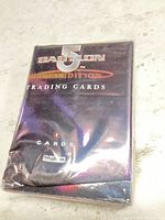 Front of sealed Babylon 5 SkyBox card pack showing logo and 8-card note