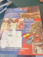 Full front cover of Daytona 24-Hour Pepsi Challenge program showing event information and damage
