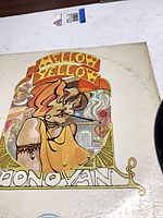 Album jacket front art showing title and wear