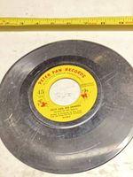 Full view of 7-inch 45 RPM record showing Peter Pan Records label and overall wear