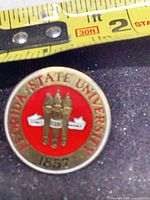 Front view showing design, text and tape measure for scale