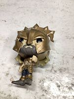 Front view of Funko Pop Armored Atlantean figure showing helmet, beard and torso armor