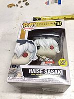 Front of boxed Funko Pop showing figure, number, stickers