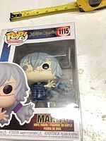 Front view of boxed Mahito #1115 figure showing window and number