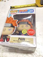 Front of boxed Pain Funko Pop showing figure, glow and GameStop stickers, item number 934