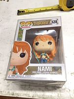 Front view of boxed Nami Pop #328 in protective sleeve