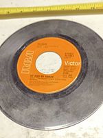 Side A of 7-inch record showing Me And My Arrow label