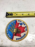 Front view of circular embroidered patch with measuring tape showing size
