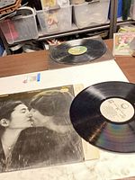 Front jacket in shrinkwrap with vinyl record visible