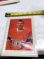Front view of framed 5x7 photograph print with measuring tape for scale